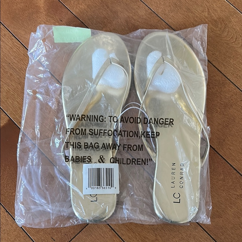 Never opened Lauren Conrad gold flip flops